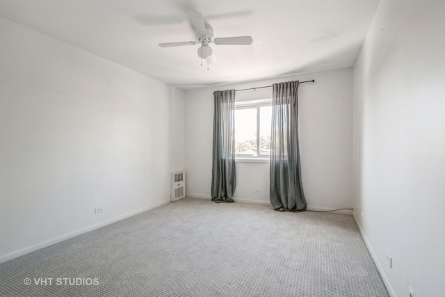 5251 W Galitz St Unit 309, Skokie, IL 60077 - spare room with a ceiling fan, light colored carpet, baseboards, and heating unit