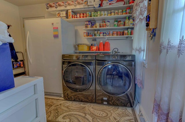 606 E Houghton St, Tuscola, IL 61953 - washroom with separate washer and dryer and light tile patterned floors