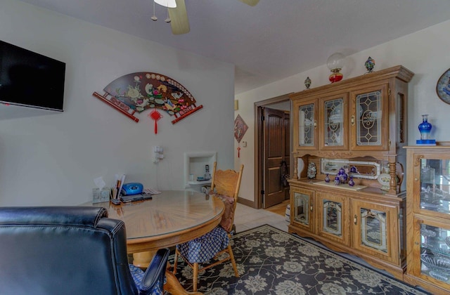 606 E Houghton St, Tuscola, IL 61953 - dining room with light tile patterned floors and a ceiling fan