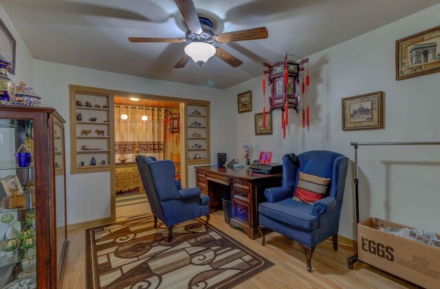 606 E Houghton St, Tuscola, IL 61953 - living area with a desk, a ceiling fan, and light wood finished floors