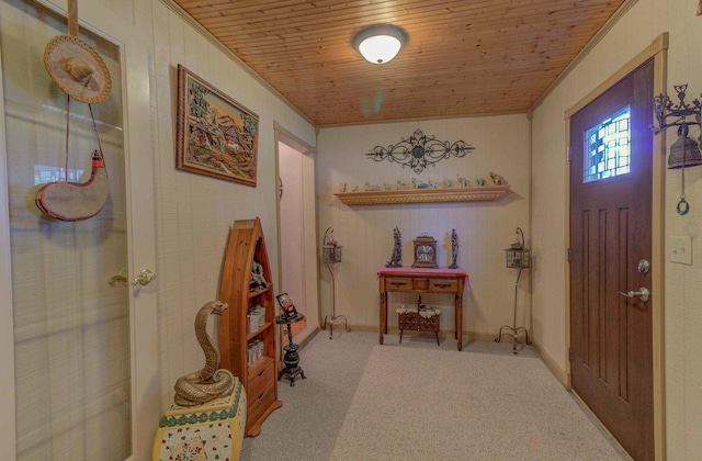 606 E Houghton St, Tuscola, IL 61953 - carpeted entrance foyer with ornamental molding, wood ceiling, and baseboards