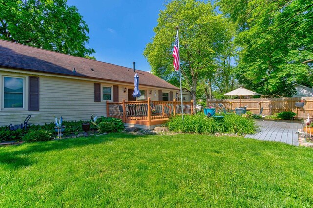 606 E Houghton St, Tuscola, IL 61953 - rear view of house with a deck