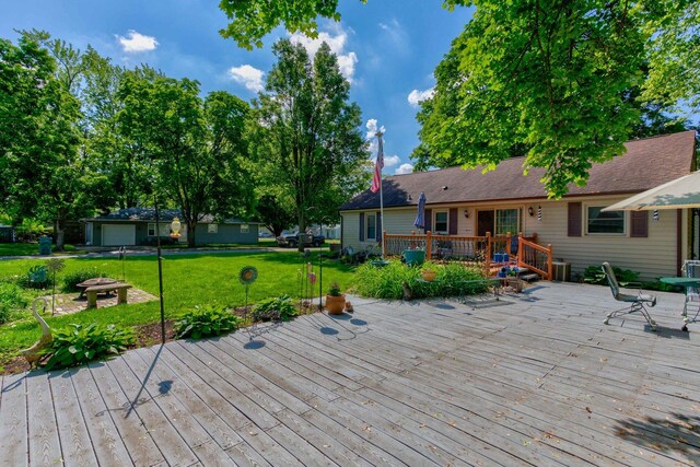 606 E Houghton St, Tuscola, IL 61953 - wooden terrace with a yard and an outdoor fire pit