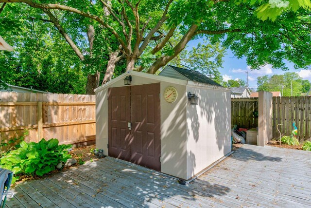 606 E Houghton St, Tuscola, IL 61953 - view of shed featuring a fenced backyard