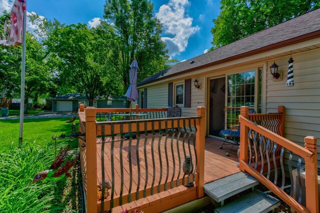 606 E Houghton St, Tuscola, IL 61953 - wooden deck featuring a yard and an outdoor structure