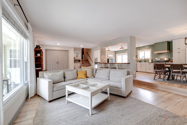 5045 S Rd, Gurnee, IL 60031 - living area with light wood-type flooring, stairs, and recessed lighting