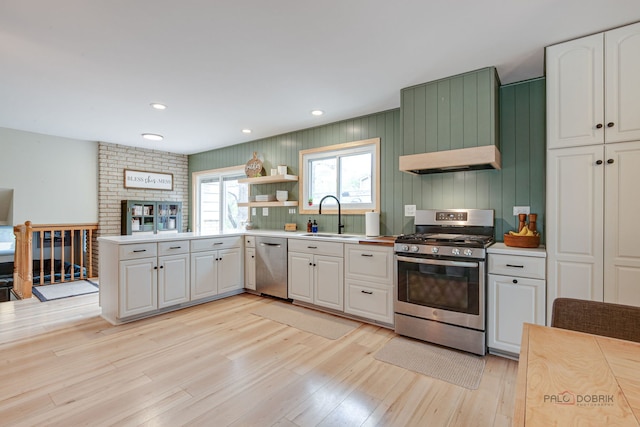5045 S Rd, Gurnee, IL 60031 - kitchen with appliances with stainless steel finishes, a sink, light wood-style floors, open shelves, and light countertops