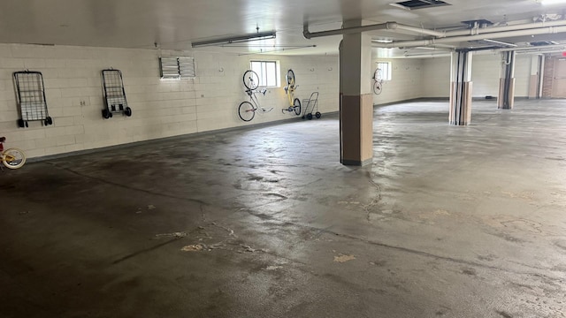 garage with concrete block wall