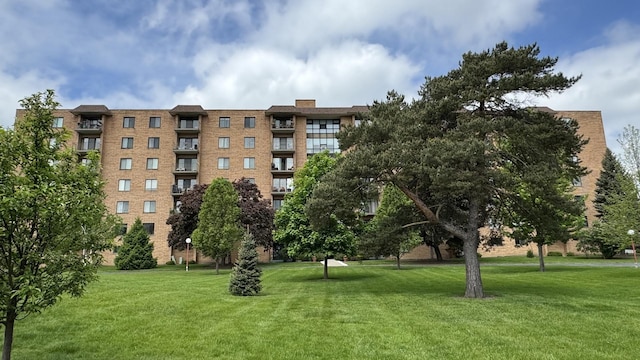 view of property's community with a yard