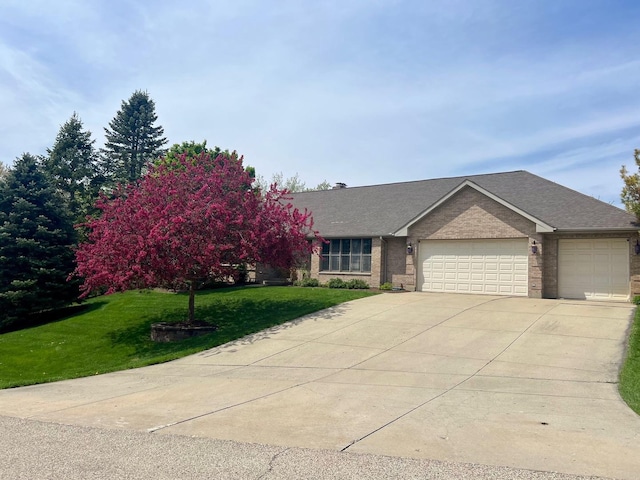 26032 W Laurel Ct, Wauconda, IL 60084 - view of front of house with a garage, concrete driveway, brick siding, a front lawn, and a shingled roof