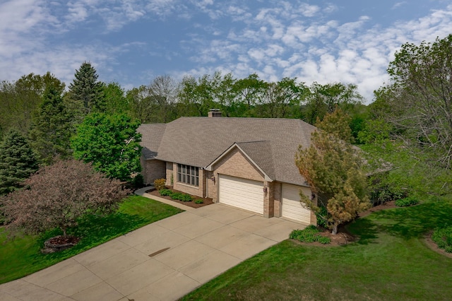 26032 W Laurel Ct, Wauconda, IL 60084 - view of front of home featuring a garage, driveway, a front yard, and brick siding