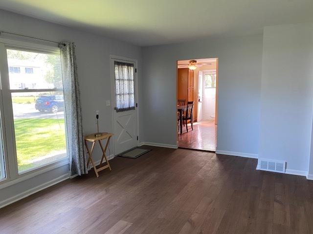 950 Arlon Rd, Aurora, IL 60506 - doorway to outside featuring dark wood-style floors, baseboards, and ceiling fan