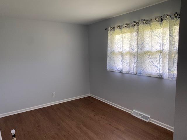 950 Arlon Rd, Aurora, IL 60506 - unfurnished room with dark wood-type flooring and baseboards