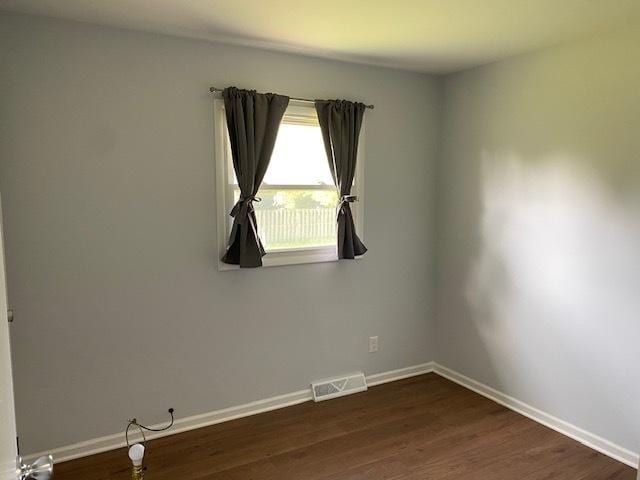 950 Arlon Rd, Aurora, IL 60506 - unfurnished room featuring baseboards and dark wood finished floors