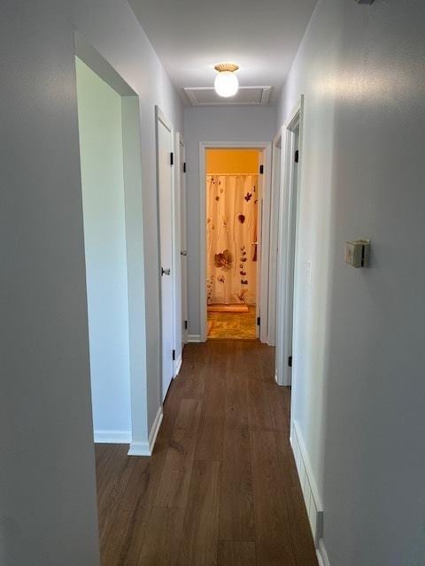 950 Arlon Rd, Aurora, IL 60506 - corridor featuring attic access, dark wood-type flooring, and baseboards