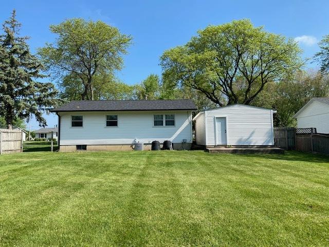 950 Arlon Rd, Aurora, IL 60506 - rear view of house featuring an outdoor structure and a shed