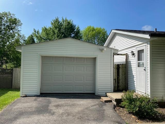 950 Arlon Rd, Aurora, IL 60506 - detached garage featuring driveway and fence