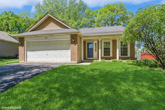 618 Hampton Cir, Elgin, IL 60120 - ranch-style house with brick siding, driveway, a garage, a front lawn, and roof with shingles