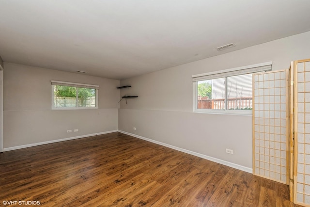 618 Hampton Cir, Elgin, IL 60120 - spare room featuring wood finished floors and baseboards
