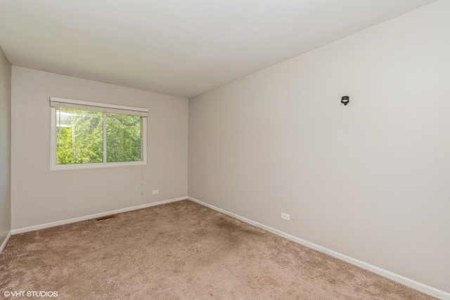 618 Hampton Cir, Elgin, IL 60120 - unfurnished room with baseboards and carpet floors