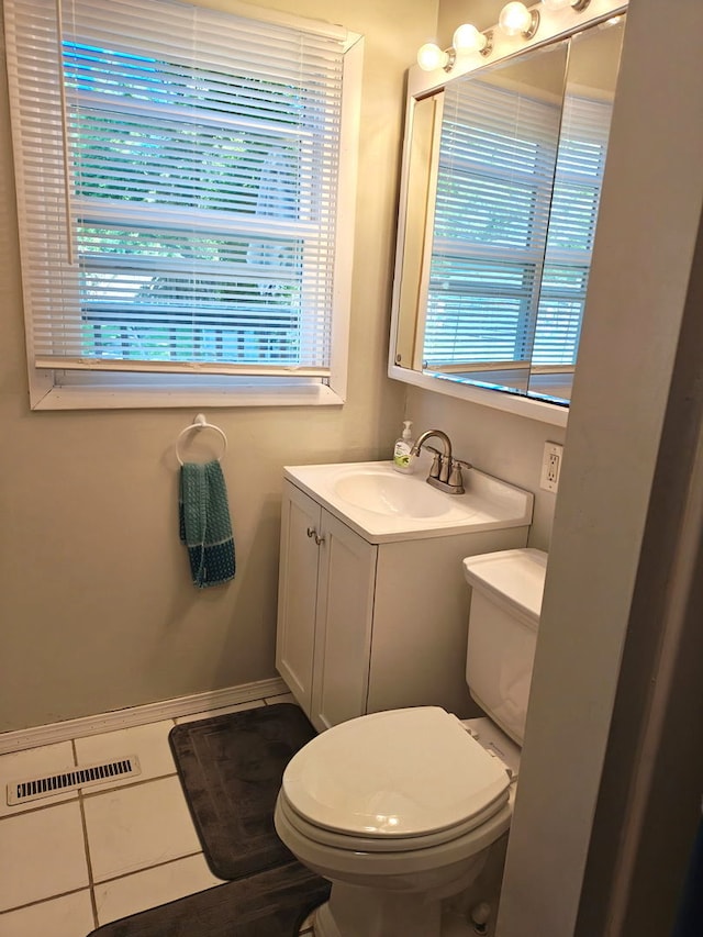 196 Susan Ln, Steger, IL 60475 - half bathroom featuring vanity, toilet, tile patterned floors, and baseboards