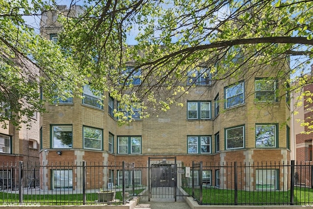 view of building exterior with a fenced front yard