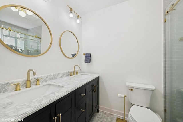 3515 W Medill Ave Unit 1W, Chicago, IL 60647 - bathroom featuring toilet, tiled shower, baseboards, and double vanity