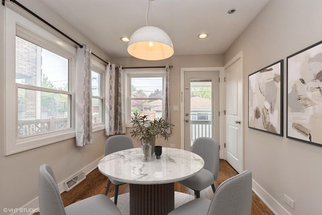 8128 N Odell Ave, Niles, IL 60714 - dining room with baseboards, wood finished floors, and recessed lighting