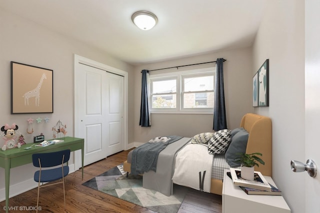 8128 N Odell Ave, Niles, IL 60714 - bedroom with wood finished floors, a closet, and baseboards