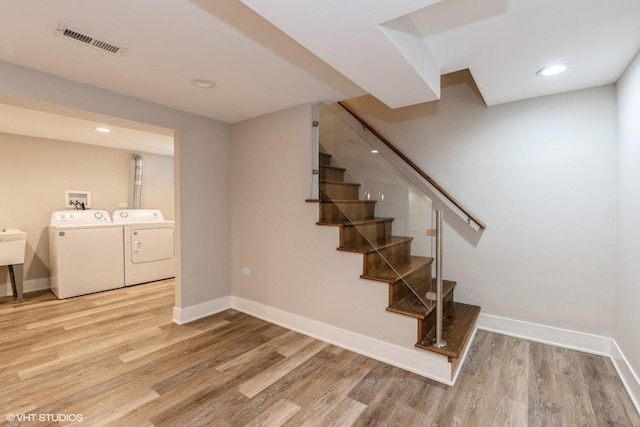 8128 N Odell Ave, Niles, IL 60714 - stairway with independent washer and dryer, wood finished floors, baseboards, and recessed lighting