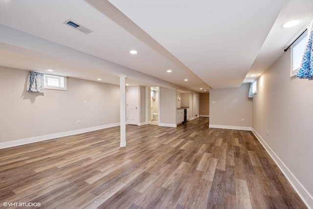 8128 N Odell Ave, Niles, IL 60714 - below grade area featuring recessed lighting, wood finished floors, and baseboards