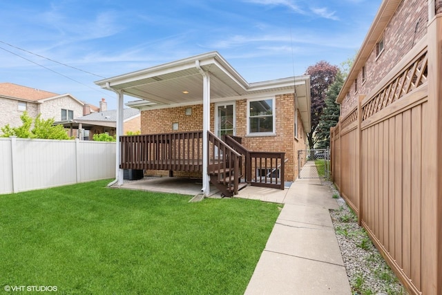 8128 N Odell Ave, Niles, IL 60714 - back of house with brick siding, a wooden deck, a gate, and cooling unit