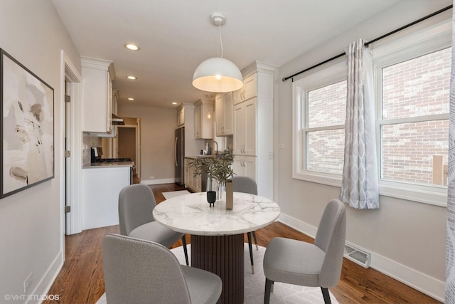 8128 N Odell Ave, Niles, IL 60714 - dining space featuring dark wood finished floors, baseboards, and recessed lighting