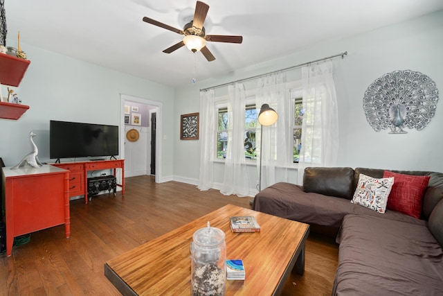 living area featuring ceiling fan and wood finished floors