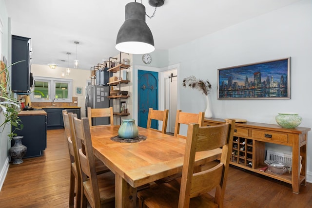 dining area with wood finished floors