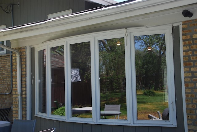 735 Lamon Ave, Wilmette, IL 60091 - view of side of property with a sunroom and brick siding