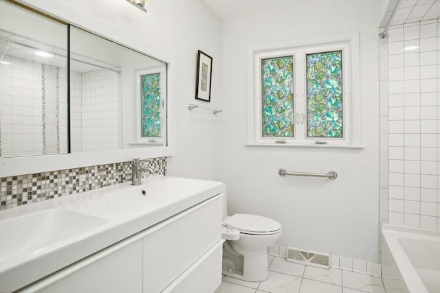 735 Lamon Ave, Wilmette, IL 60091 - full bathroom featuring toilet, marble finish flooring, double vanity, and baseboards