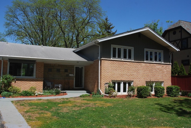 735 Lamon Ave, Wilmette, IL 60091 - split level home with a front yard and brick siding