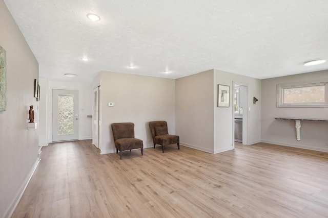 735 Lamon Ave, Wilmette, IL 60091 - living area with plenty of natural light, light wood finished floors, baseboards, and recessed lighting