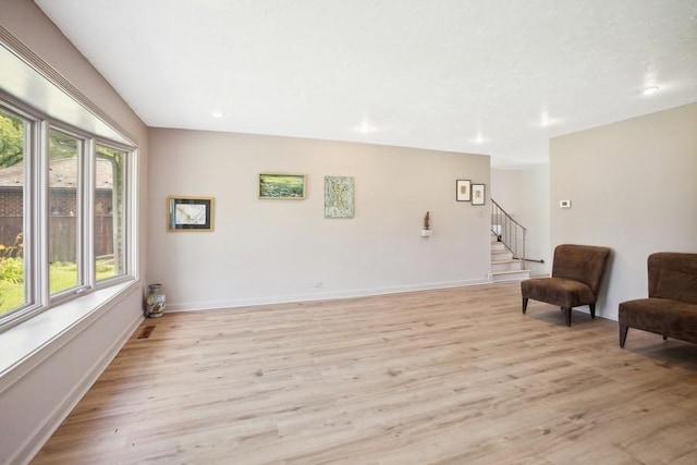 735 Lamon Ave, Wilmette, IL 60091 - living area with light wood-type flooring, stairs, recessed lighting, and baseboards