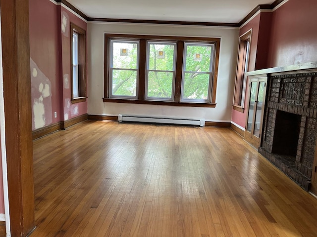 3423 N Tripp Ave, Chicago, IL 60641 - unfurnished living room with a baseboard heating unit, crown molding, wood-type flooring, a brick fireplace, and plenty of natural light