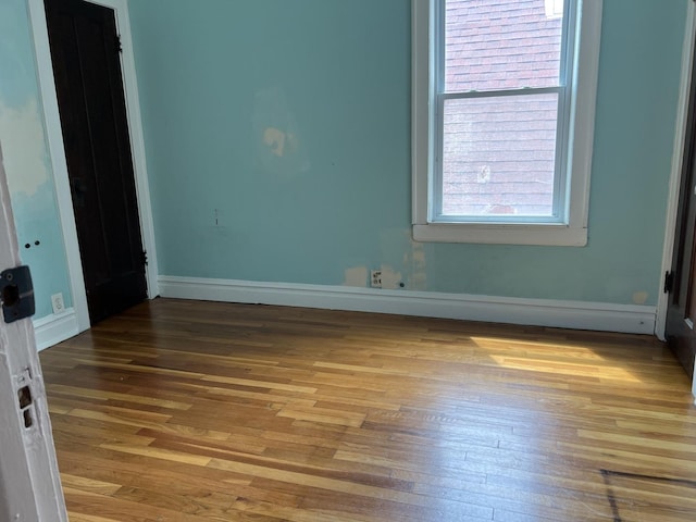 3423 N Tripp Ave, Chicago, IL 60641 - empty room with hardwood / wood-style flooring and baseboards