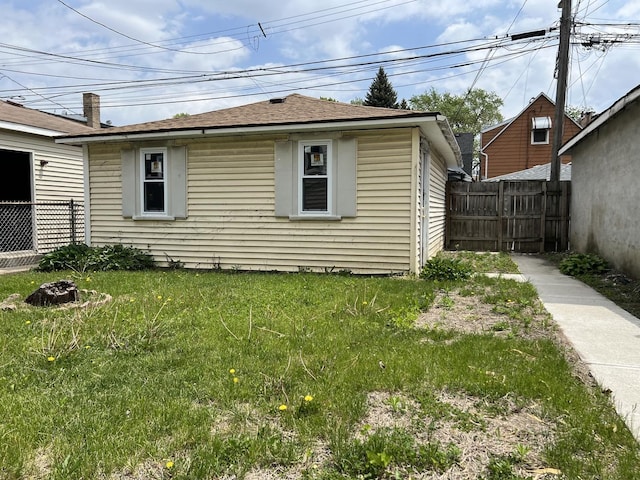 3423 N Tripp Ave, Chicago, IL 60641 - view of side of property featuring a shingled roof