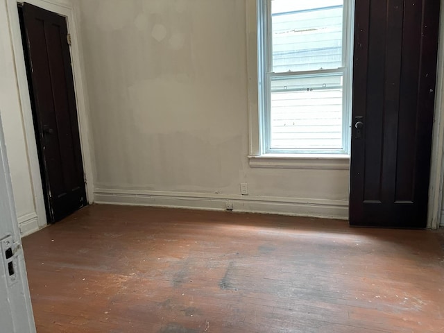 3423 N Tripp Ave, Chicago, IL 60641 - unfurnished room with hardwood / wood-style flooring, plenty of natural light, and baseboards