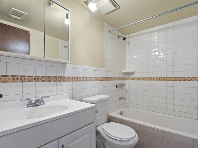 500 Park Ave Unit 535, Calumet City, IL 60409 - full bath with tiled shower / bath combo, toilet, tile walls, and vanity