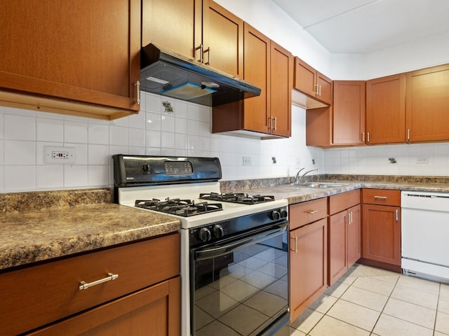 500 Park Ave Unit 535, Calumet City, IL 60409 - kitchen with range with gas stovetop, under cabinet range hood, white dishwasher, a sink, and tasteful backsplash