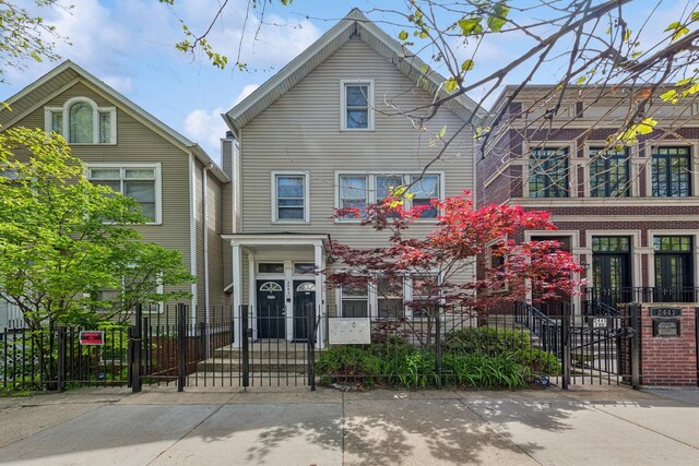 2443 N Marshfield Ave, Chicago, IL 60614 - townhome / multi-family property featuring a gate and a fenced front yard