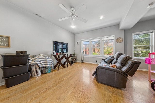 2443 N Marshfield Ave, Chicago, IL 60614 - living room featuring healthy amount of natural light, lofted ceiling, wood finished floors, ceiling fan, and baseboards