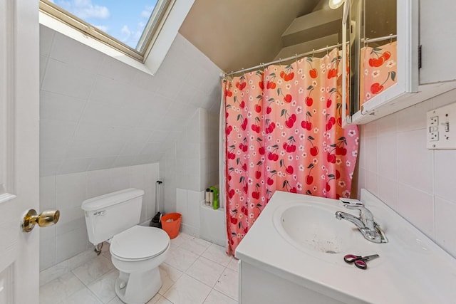 2443 N Marshfield Ave, Chicago, IL 60614 - full bath with vaulted ceiling, tile walls, a skylight, toilet, and vanity