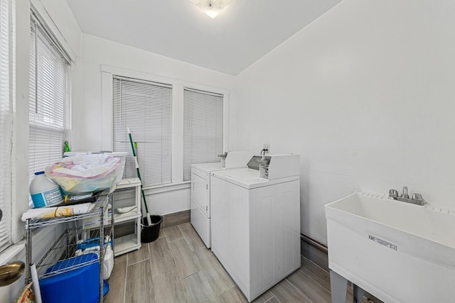 2443 N Marshfield Ave, Chicago, IL 60614 - washroom featuring washer and dryer, a sink, and wood tiled floors